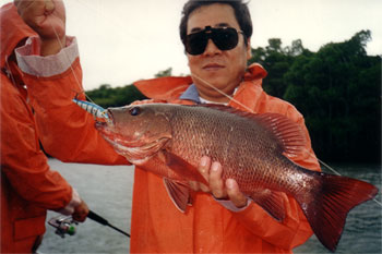 japanese fisherman with small fish